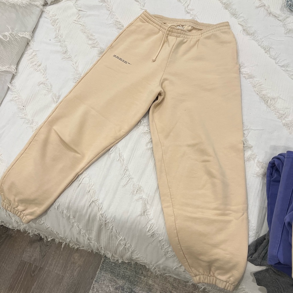 Panagia is sweat set in creme. Still in great condition, BUT not brand new.